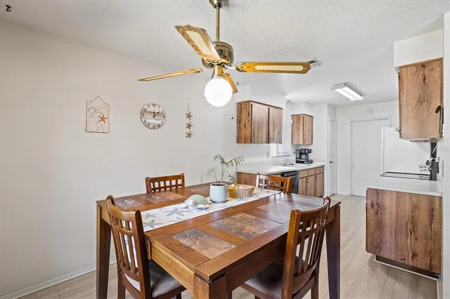 a bed room with a bed and a ceiling fan