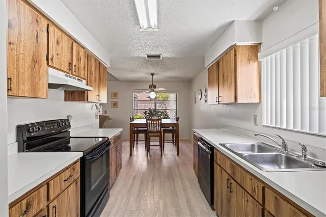 a bathroom with a shower curtain and a window