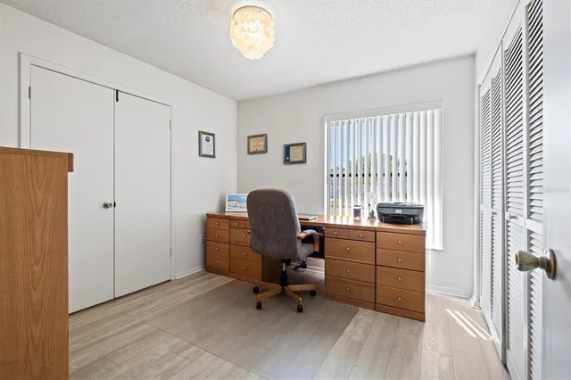 a view of a backyard with a patio and a garden