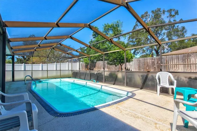 an aerial view of multiple houses with yard