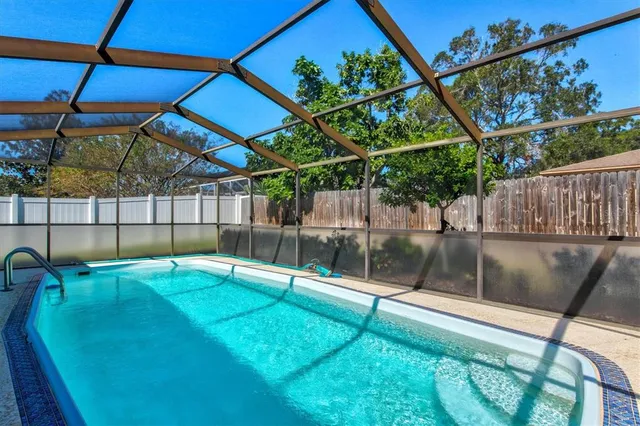 a view of a swimming pool with a patio