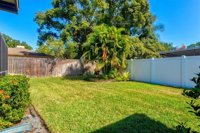 a view of a swimming pool with a yard