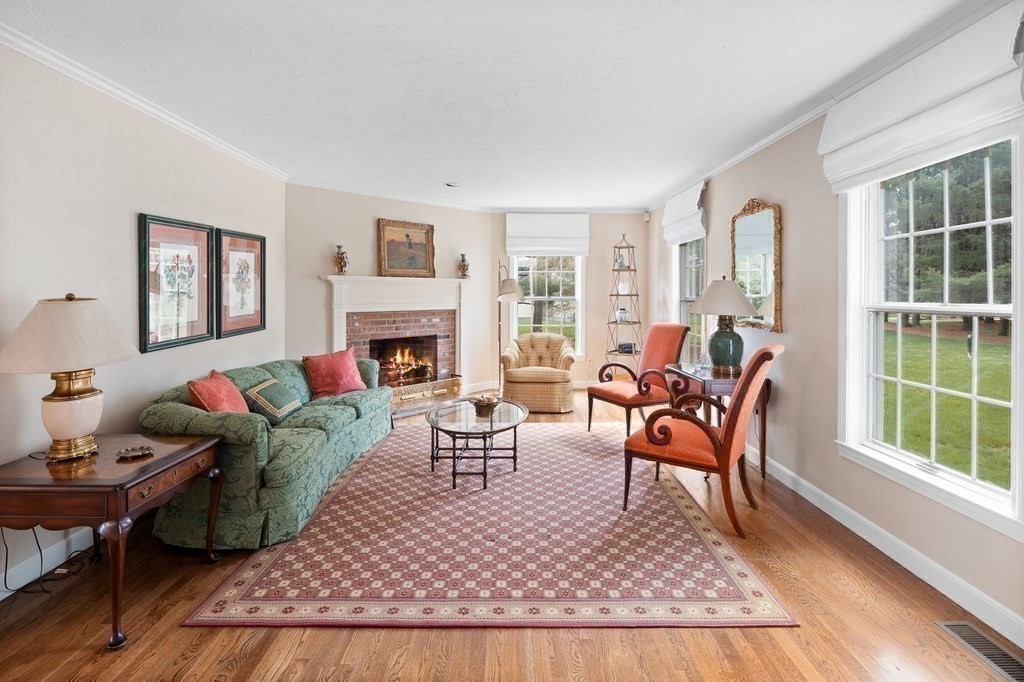14 Wright Farm Concord, MA 01742 - Photo 12 of 34 a living room with furniture a rug and a fireplace