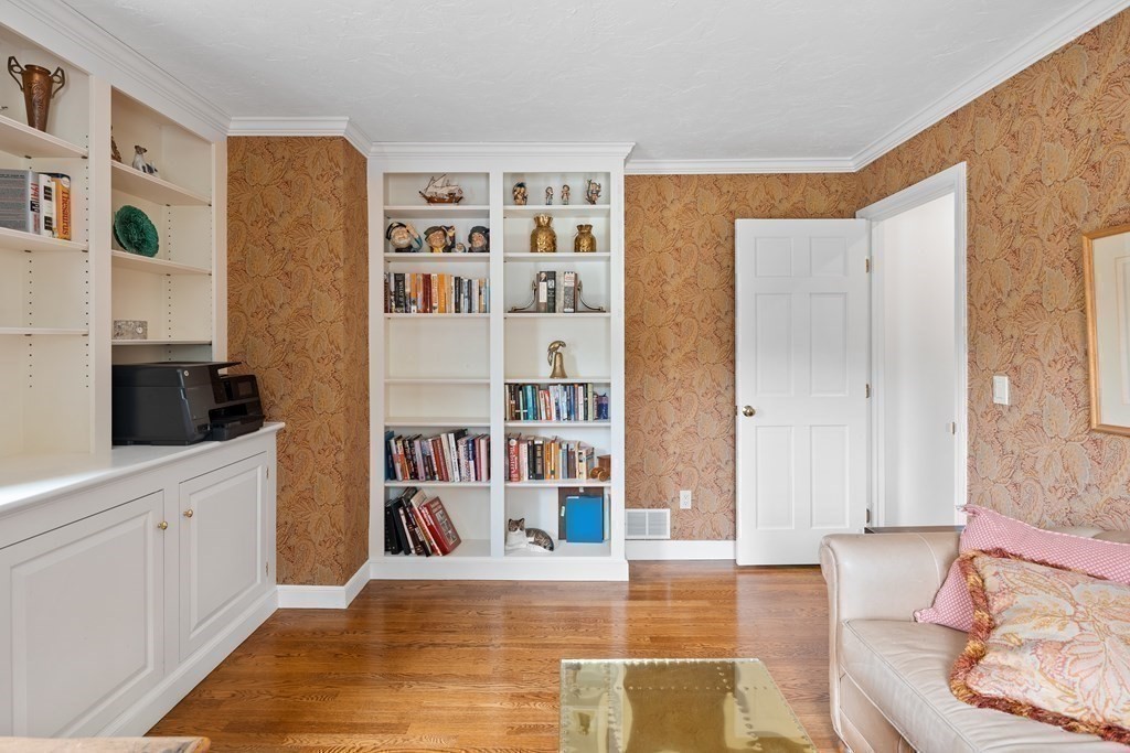 14 Wright Farm Concord, MA 01742 - Photo 16 of 34 a living room with stainless steel appliances cabinets and a book shelf