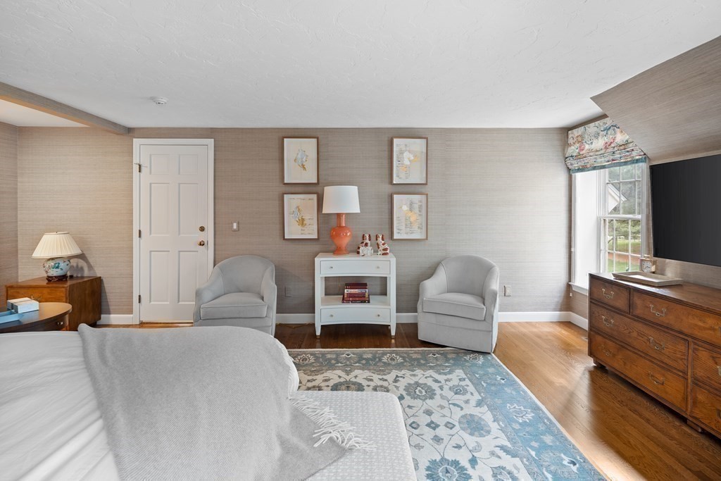 14 Wright Farm Concord, MA 01742 - Photo 19 of 34 a bedroom with a balcony a bed and a couch