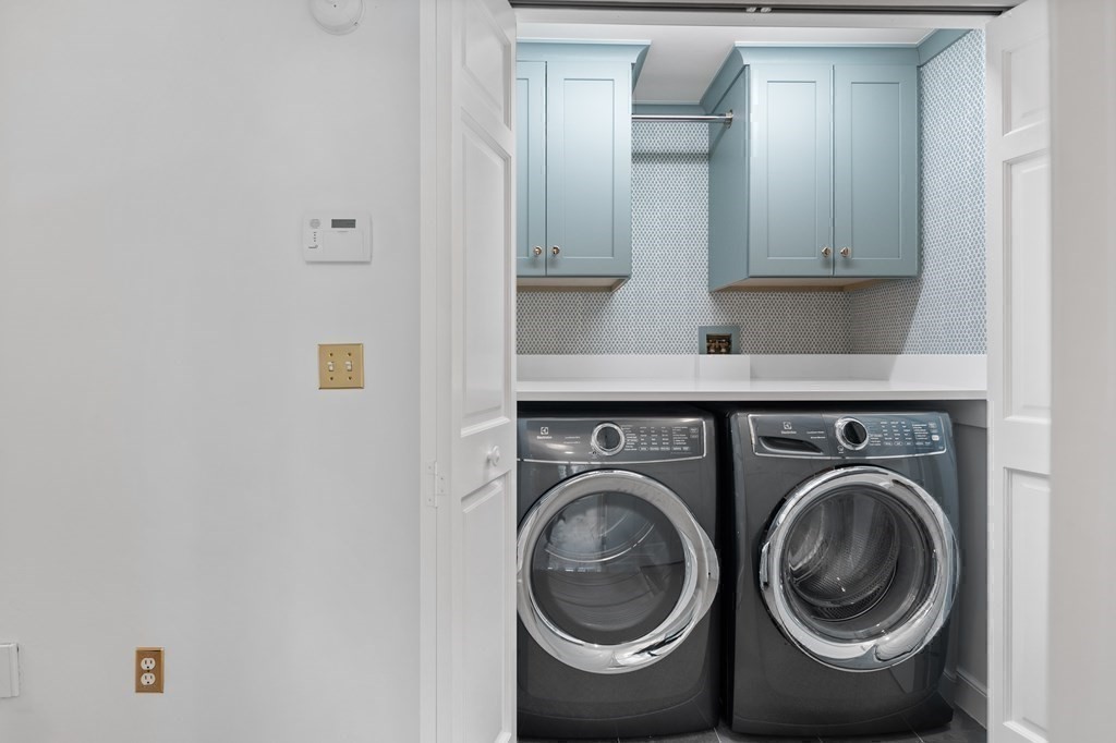 14 Wright Farm Concord, MA 01742 - Photo 22 of 34 a view of storage and utility room with washer and dryer