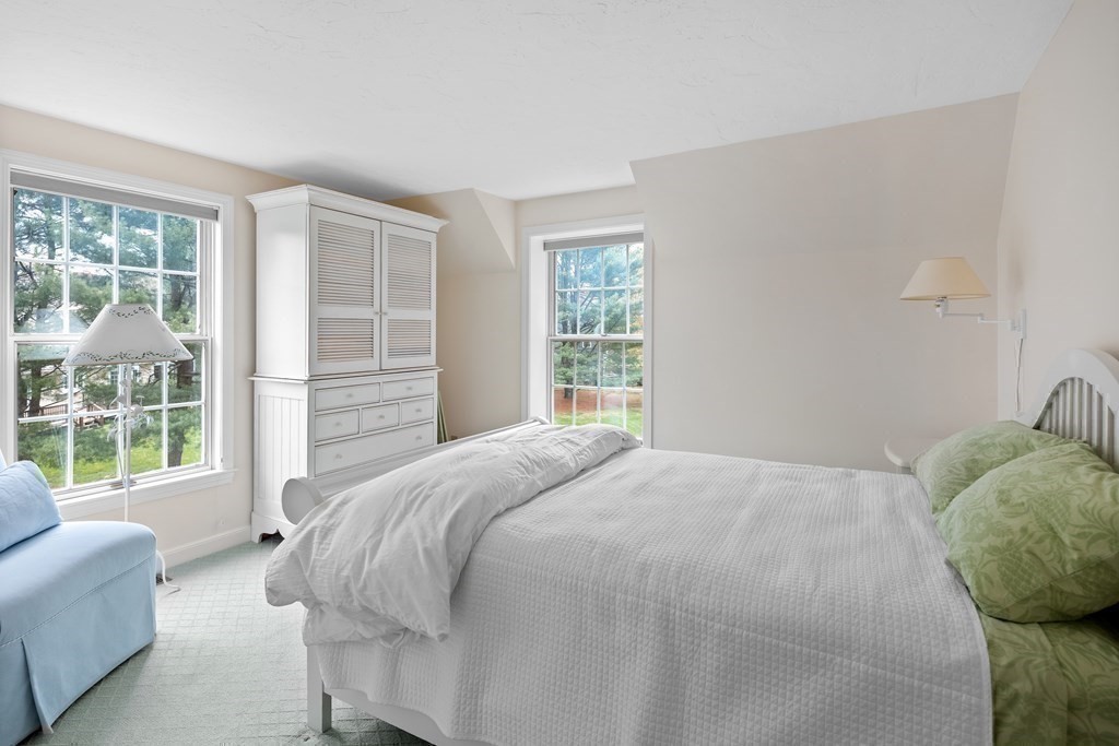 14 Wright Farm Concord, MA 01742 - Photo 24 of 34 a bedroom with a bed and a couch next to a window