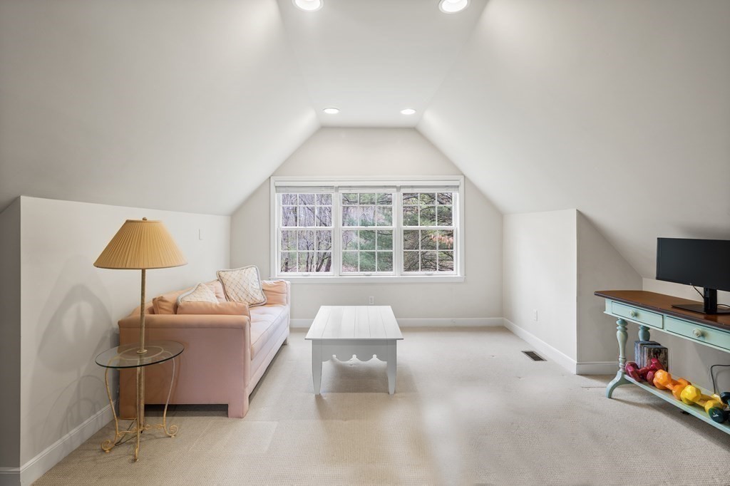 14 Wright Farm Concord, MA 01742 - Photo 26 of 34 a living room with furniture and a flat screen tv