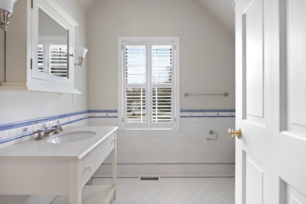 14 Wright Farm Concord, MA 01742 - Photo 27 of 34 a bathroom with a bathtub a shower and a window