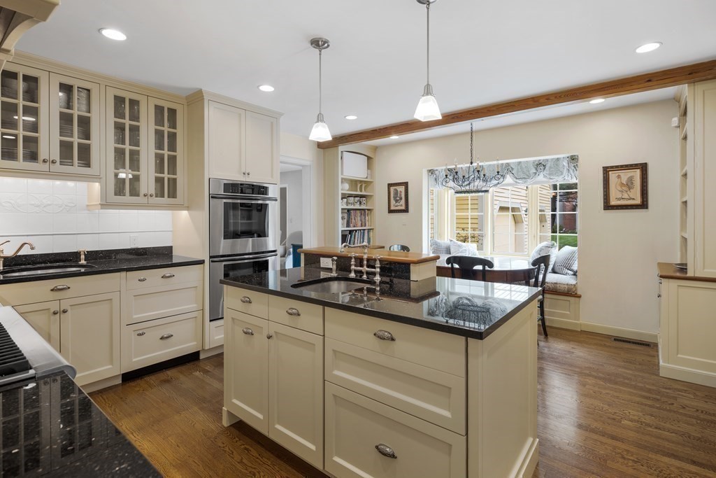 14 Wright Farm Concord, MA 01742 - Photo 3 of 34 a kitchen with granite countertop kitchen island white cabinets and refrigerator
