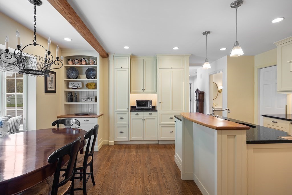 14 Wright Farm Concord, MA 01742 - Photo 7 of 34 a kitchen with stainless steel appliances kitchen island granite countertop a table chairs and a refrigerator