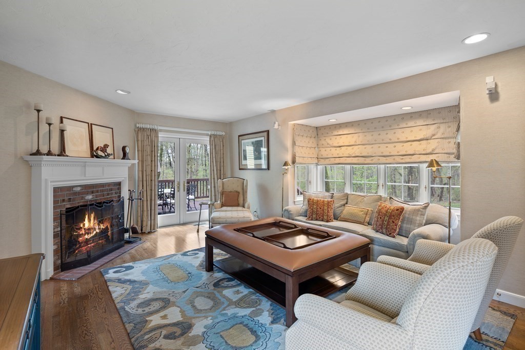 14 Wright Farm Concord, MA 01742 - Photo 10 of 34 a living room with furniture a fireplace and a large window