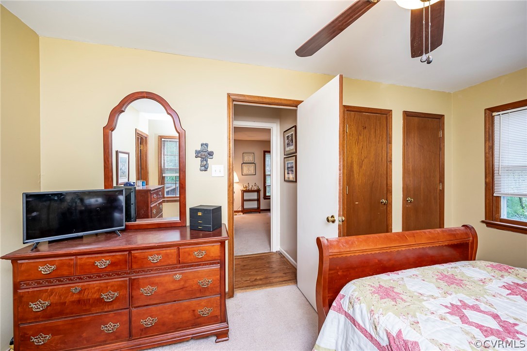 2806 Iverson Road Midlothian, VA 23112 - Photo 16 of 27 a bedroom with a large bed and a dresser