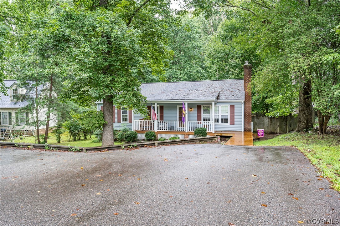 2806 Iverson Road Midlothian, VA 23112 - Photo 3 of 27 a view of a house with pool and a big yard
