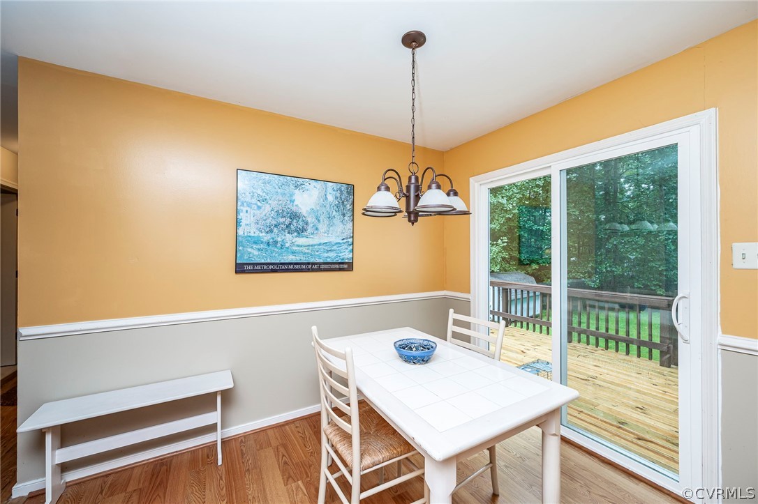 2806 Iverson Road Midlothian, VA 23112 - Photo 8 of 27 a view of a dining room with furniture window and wooden floor
