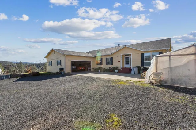 a view of an outdoor space with wooden floor