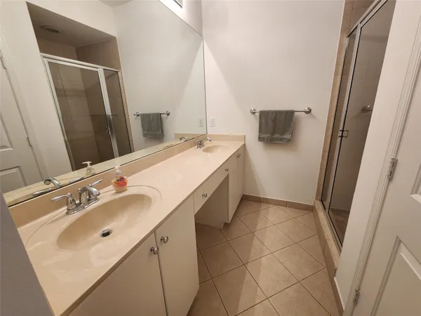 a bathroom with a sink and mirror