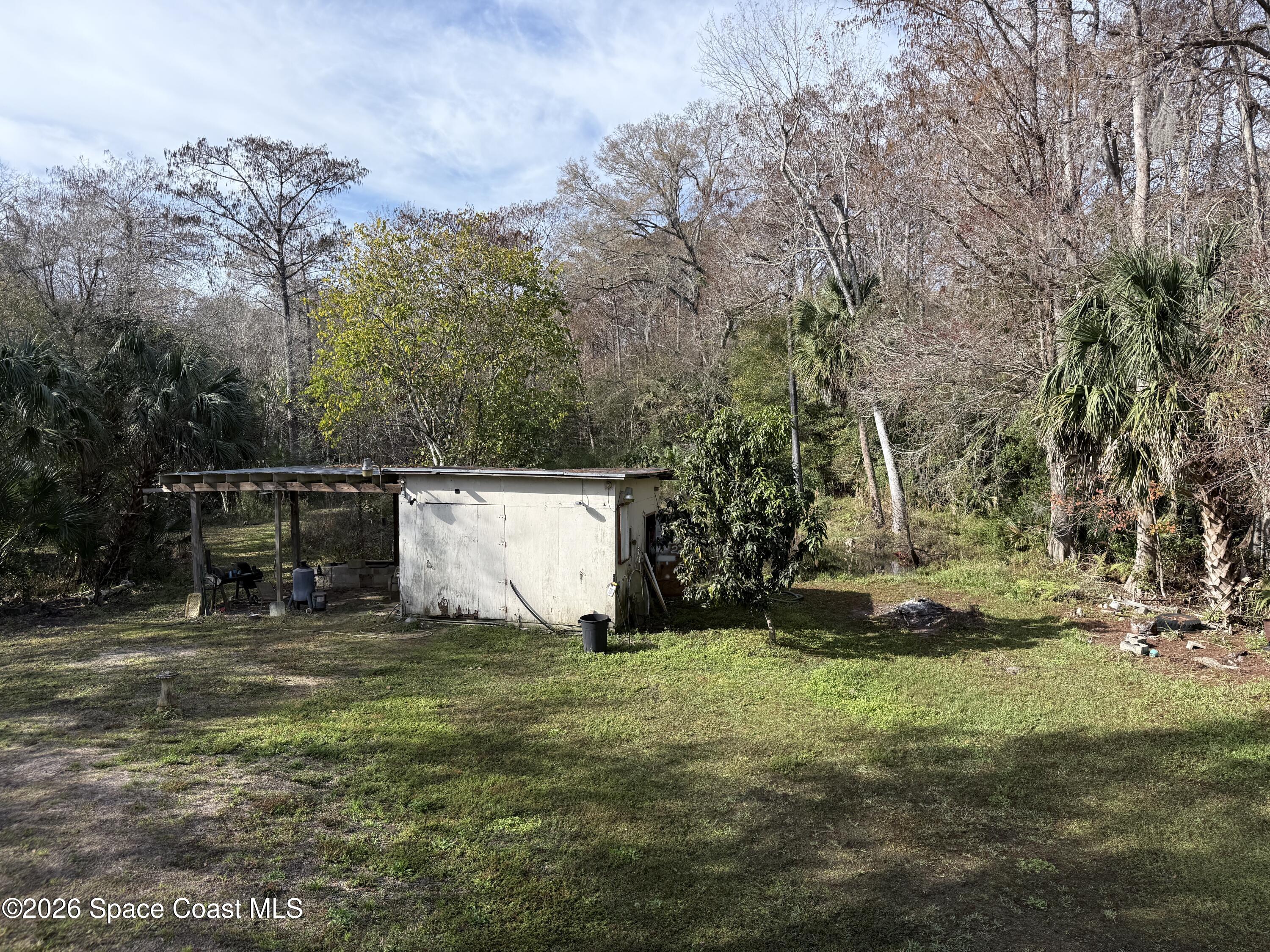 4590 Hog Valley Road Mims, FL 32754 - Photo 19 of 29 a view of backyard with green space