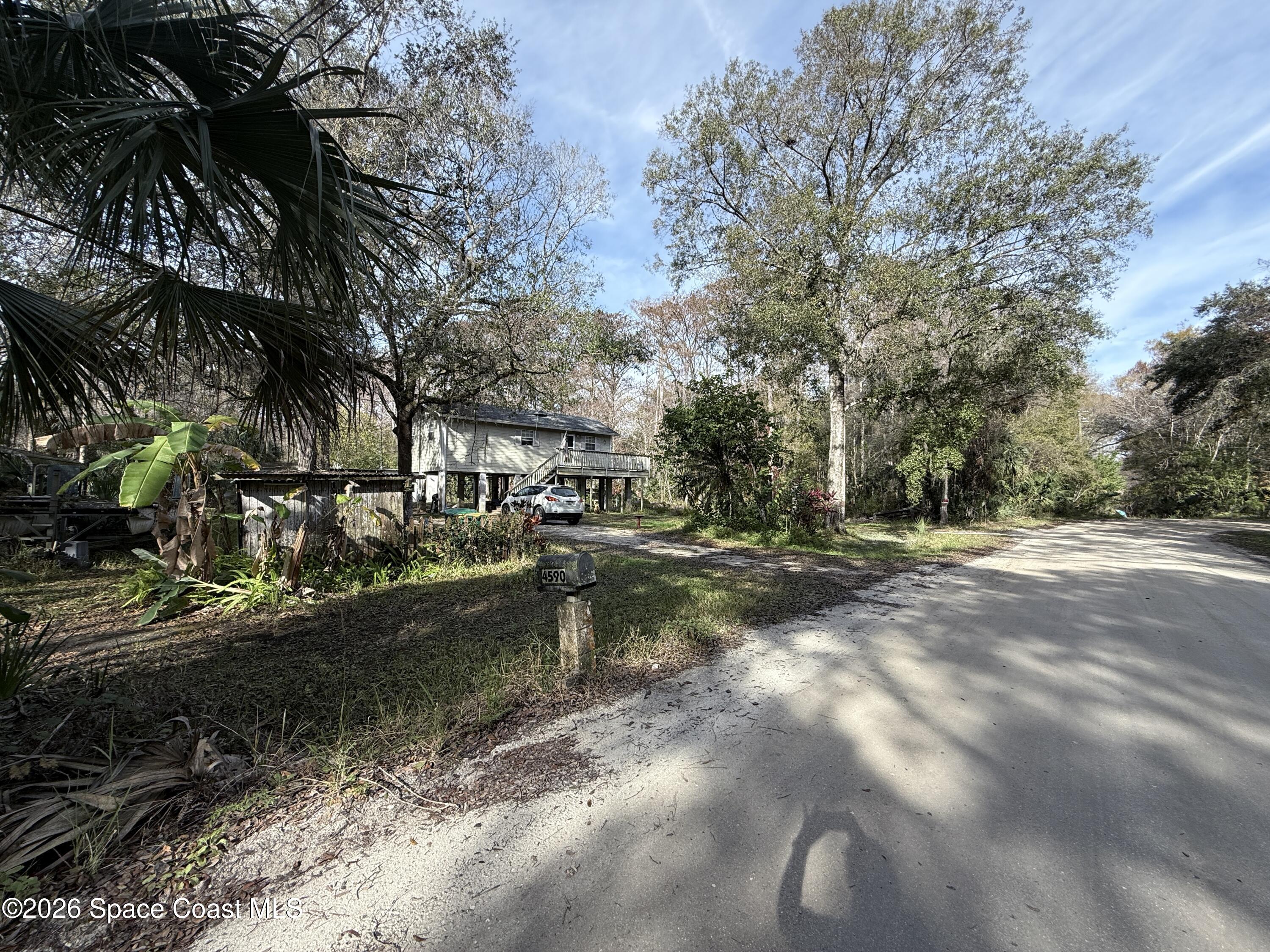 4590 Hog Valley Road Mims, FL 32754 - Photo 2 of 29 a view of swimming pool with a yard