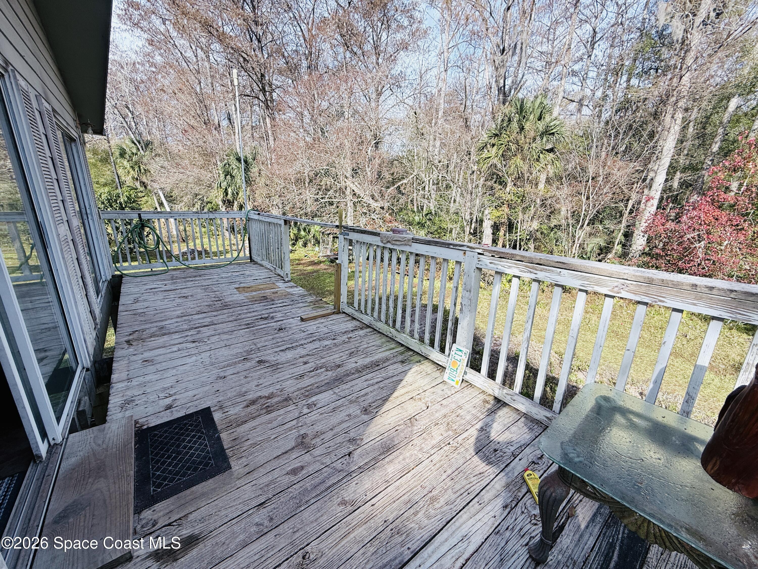4590 Hog Valley Road Mims, FL 32754 - Photo 21 of 29 a view of balcony with wooden floor