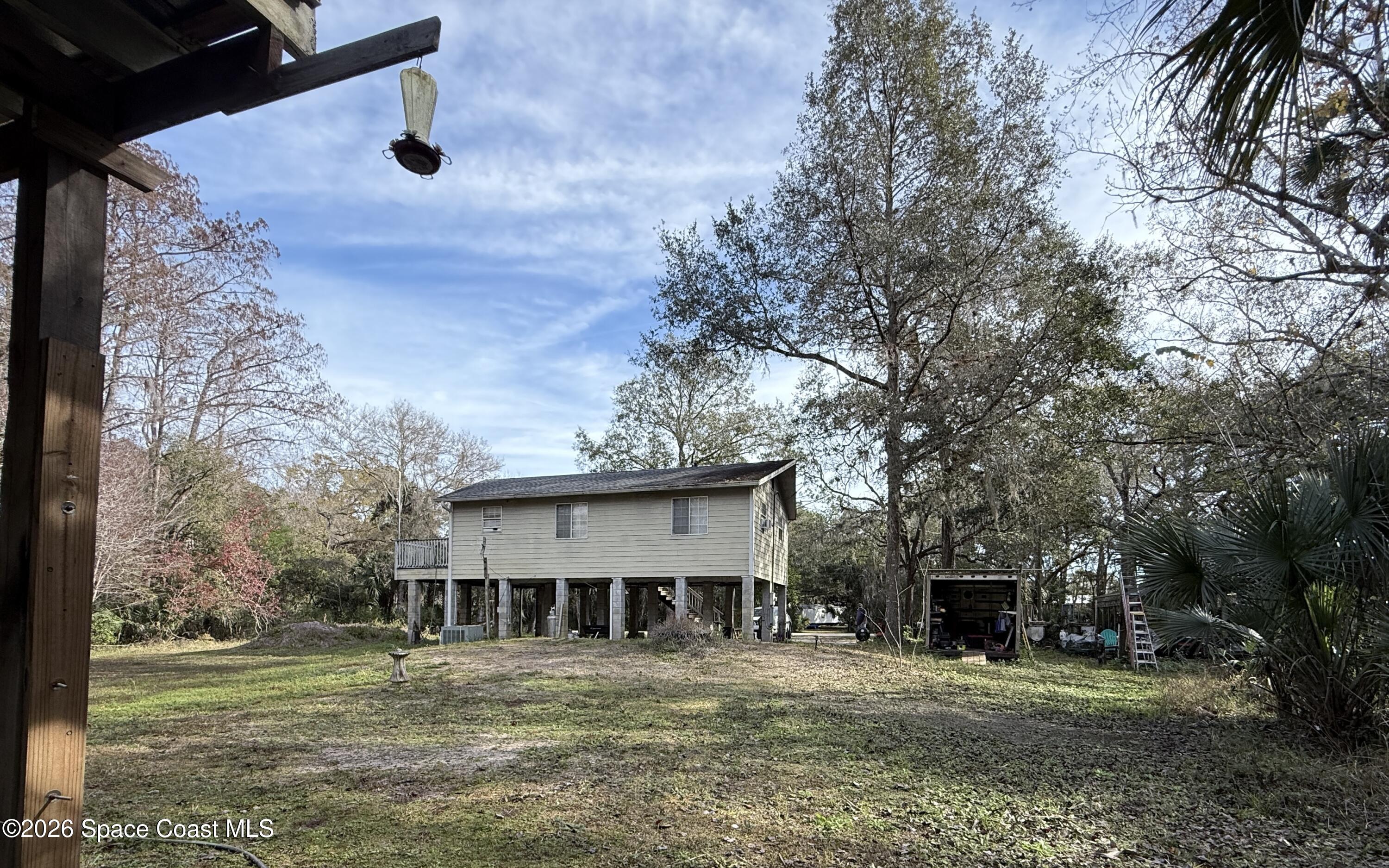 4590 Hog Valley Road Mims, FL 32754 - Photo 26 of 29 a view of a house with a yard