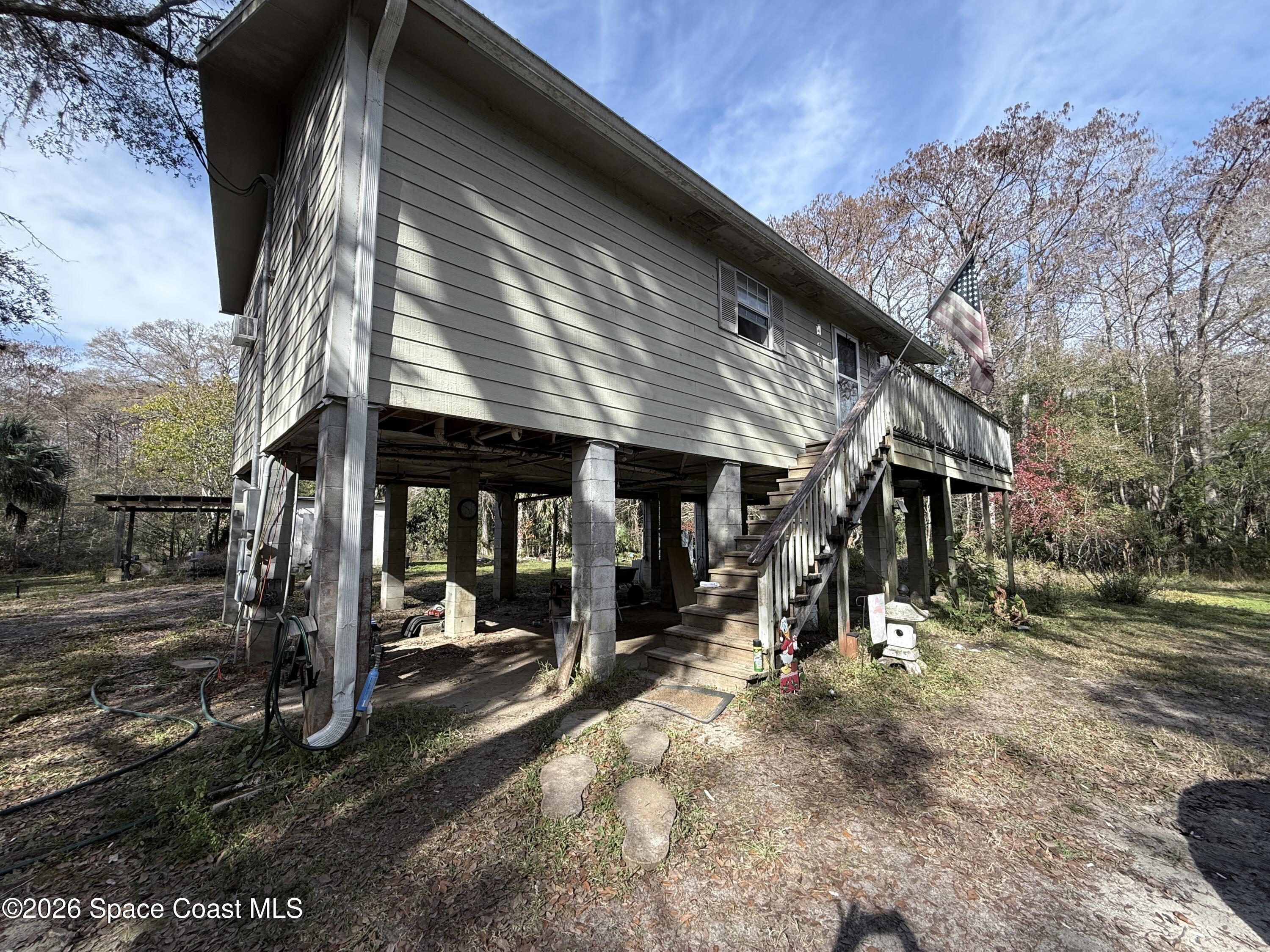 4590 Hog Valley Road Mims, FL 32754 - Photo 4 of 29 a view of a big room with wooden roof