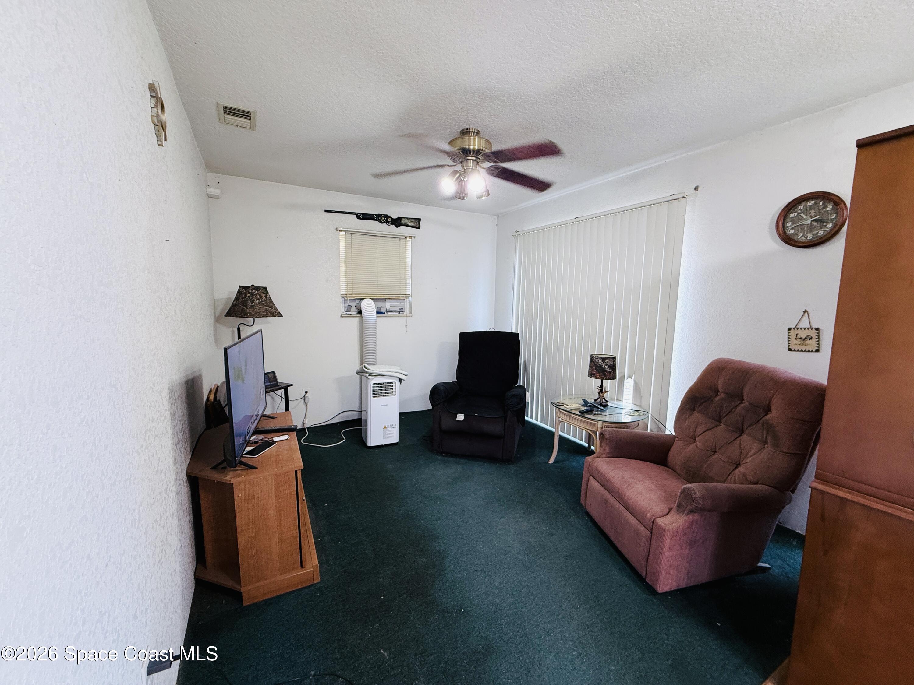 4590 Hog Valley Road Mims, FL 32754 - Photo 6 of 29 a living room with furniture