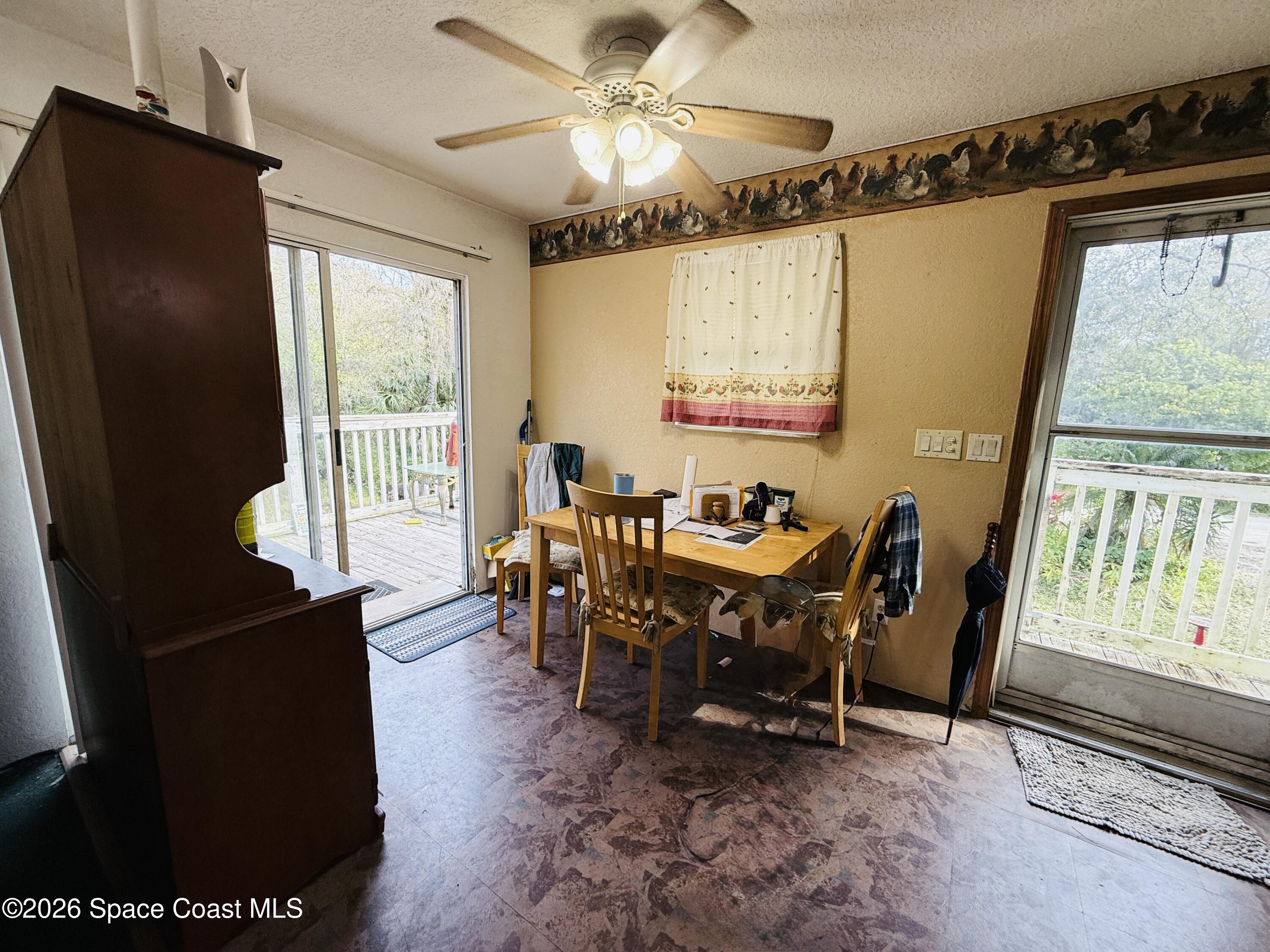 4590 Hog Valley Road Mims, FL 32754 - Photo 8 of 29 a view of a dining room with furniture window and outside view