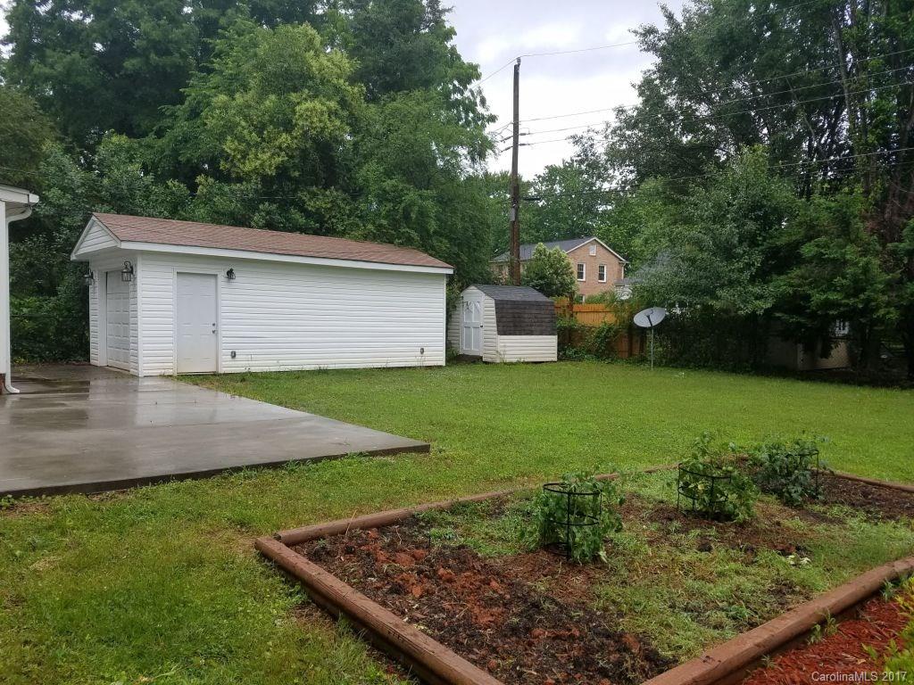 543 Scaleybark Road Charlotte, NC 28209 - Photo 22 of 24 a view of a backyard with plants and a patio