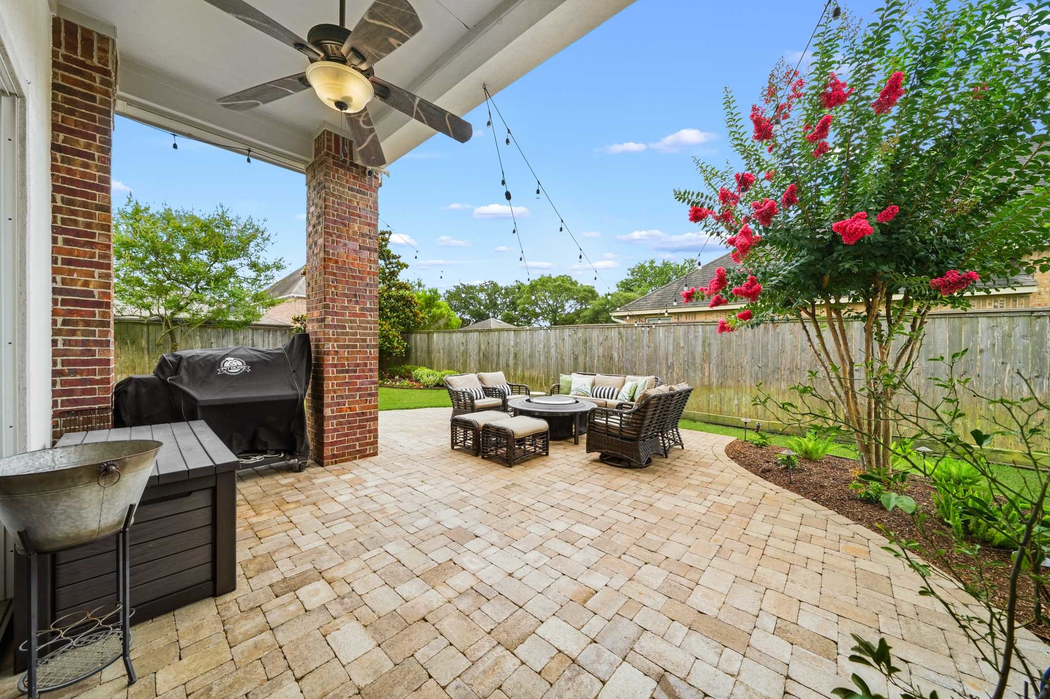 17610 Strackfield Lane Tomball, TX 77377 - Photo 50 of 50 The expansive brick paver patio extends well beyond the covered porch, creating an exceptional outdoor living space perfect for entertaining, dining al fresco, or simply enjoying the outdoors. Welcome Home!