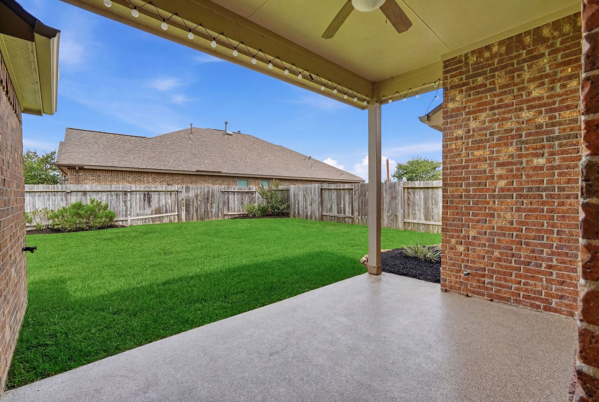 18227 Tacoma Ridge Drive Tomball, TX 77377 - Photo 34 of 45 Covered patio offering a shaded outdoor retreat for relaxing or entertaining.