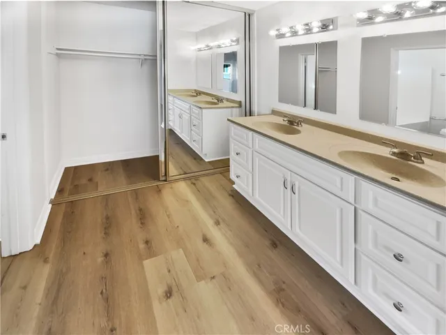 a spacious bathroom with a granite countertop sink