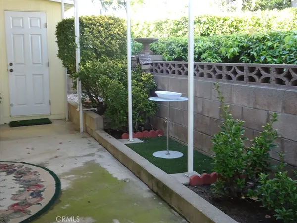 a bedroom with a bed and dresser with mirror