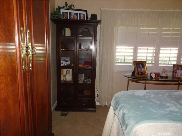 a view of a dining room with furniture and window