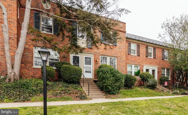 a view of a building with a yard