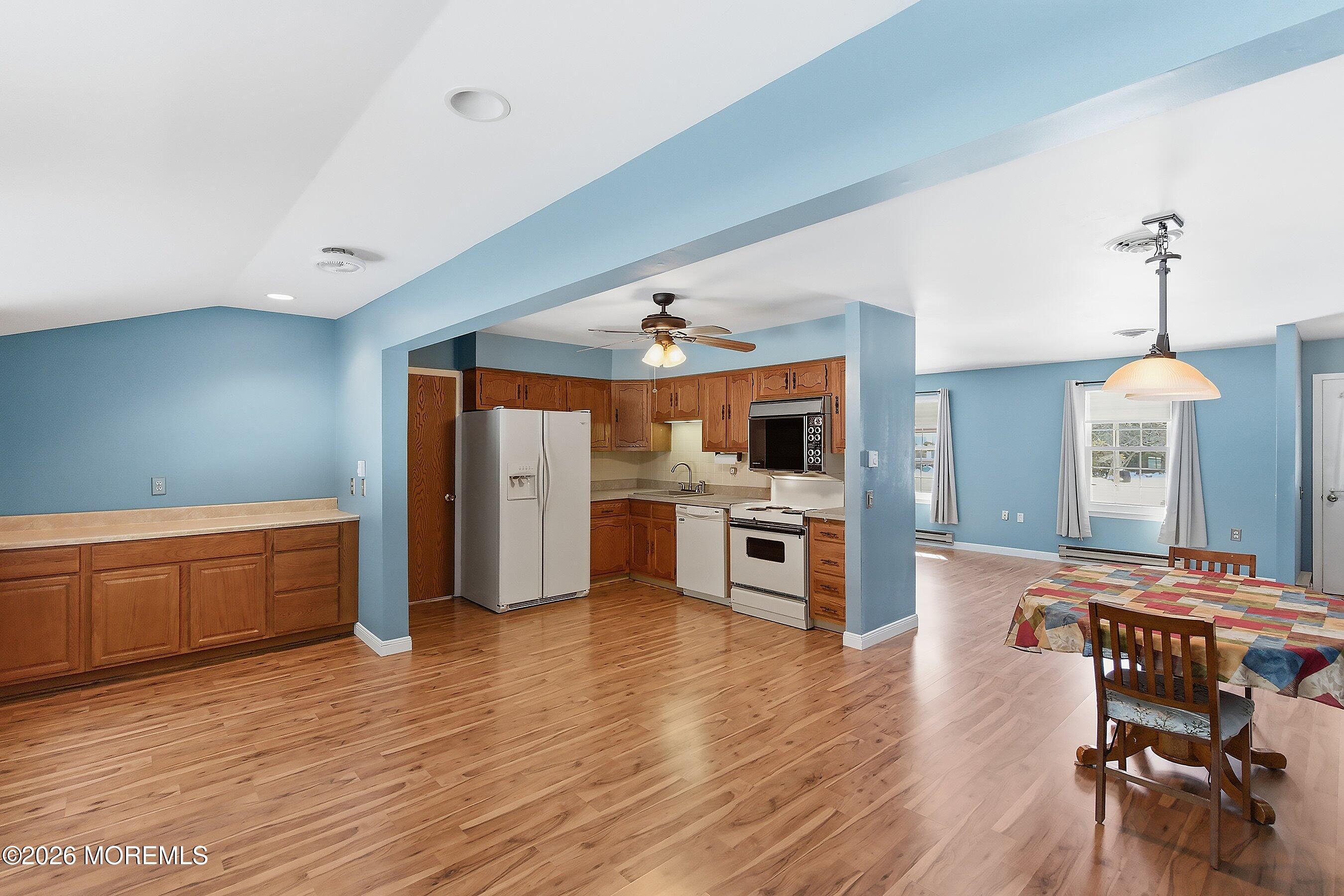 14 Medford Road, Unit 61 Whiting, NJ 08759 - Photo 11 of 36 a living room with stainless steel appliances kitchen island granite countertop furniture and a kitchen view