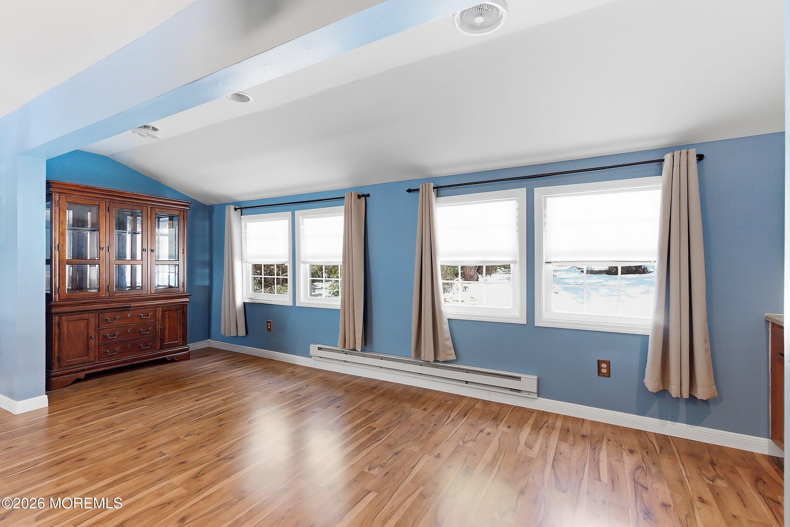14 Medford Road, Unit 61 Whiting, NJ 08759 - Photo 12 of 36 a view of an empty room with wooden floor and a window