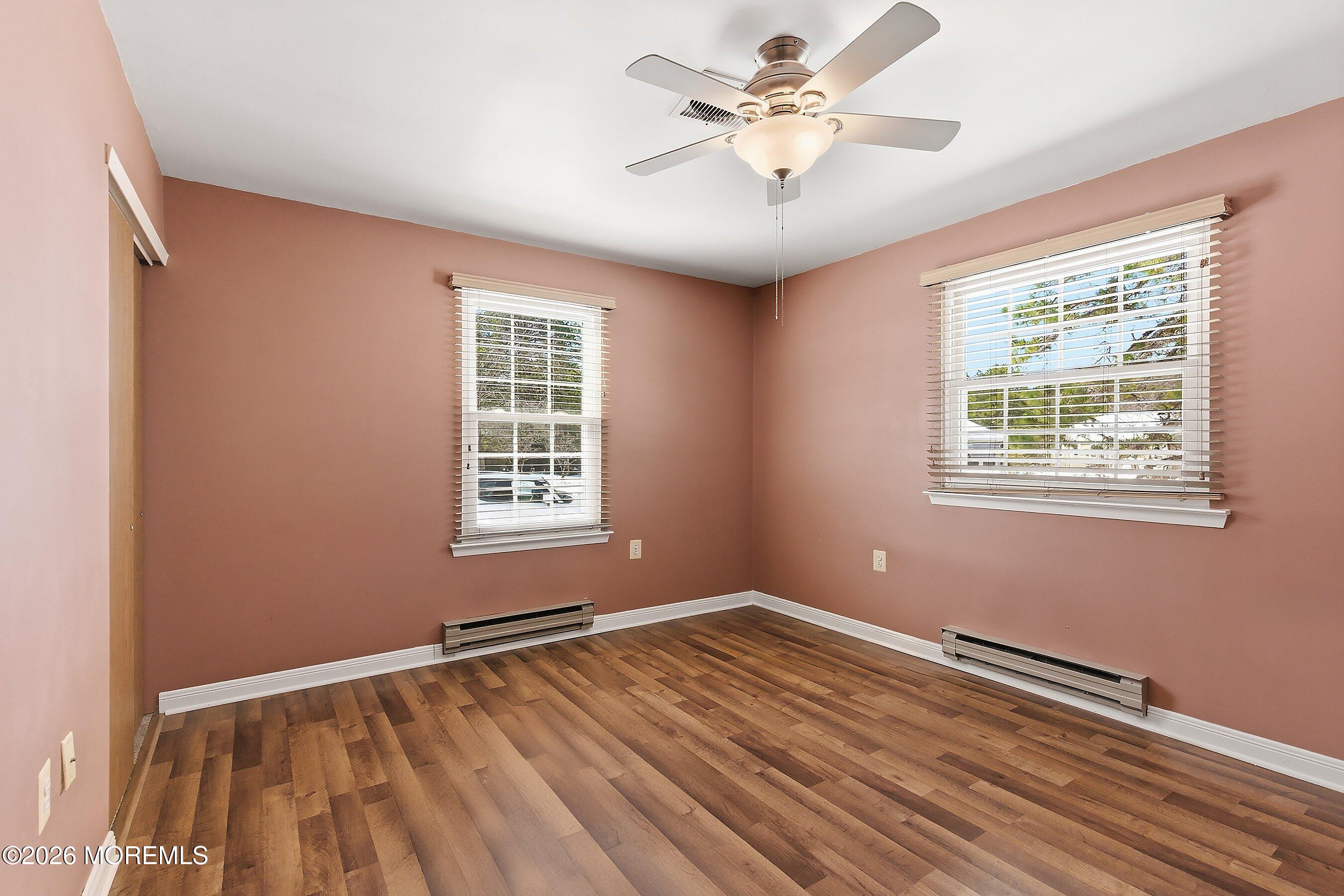 14 Medford Road, Unit 61 Whiting, NJ 08759 - Photo 16 of 36 a view of an empty room with wooden floor and a window