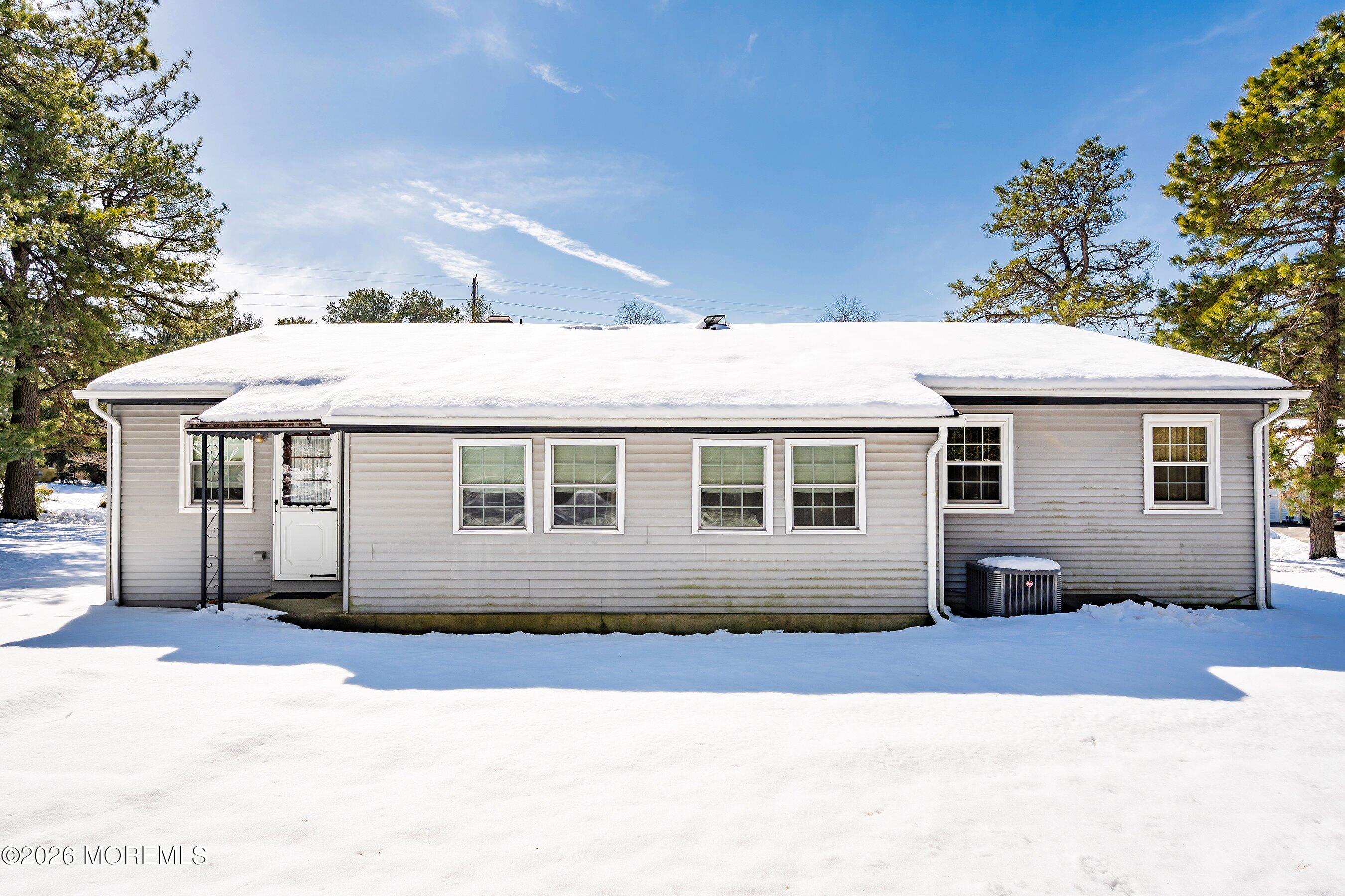 14 Medford Road, Unit 61 Whiting, NJ 08759 - Photo 19 of 36 a front view of a house with a yard
