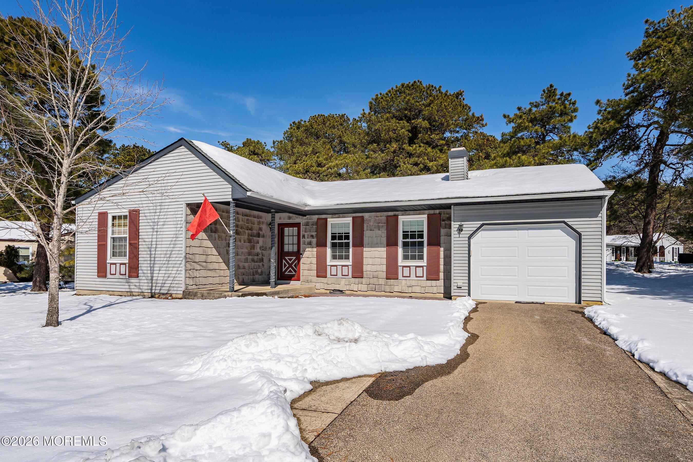 14 Medford Road, Unit 61 Whiting, NJ 08759 - Photo 26 of 36 a front view of a house with a garden and entryway