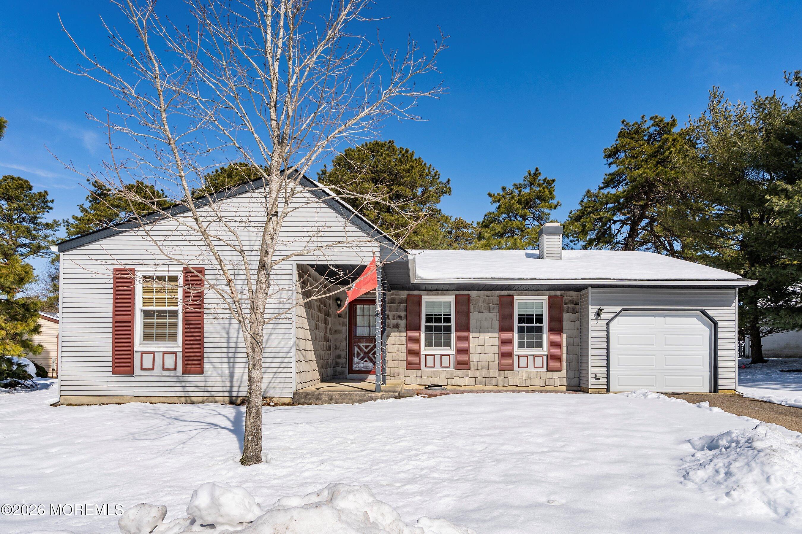 14 Medford Road, Unit 61 Whiting, NJ 08759 - Photo 29 of 36 a front view of a house with a outdoor space