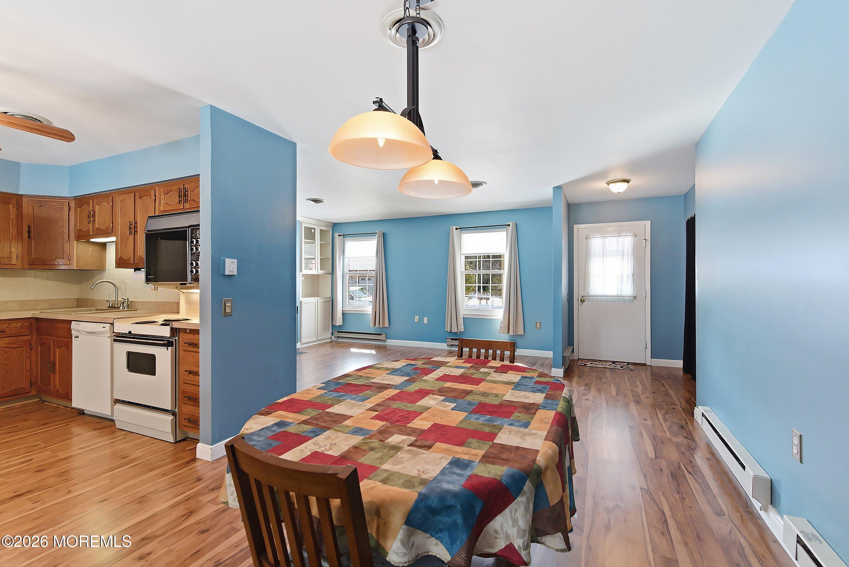 14 Medford Road, Unit 61 Whiting, NJ 08759 - Photo 5 of 36 a bedroom with a bed and wooden floor