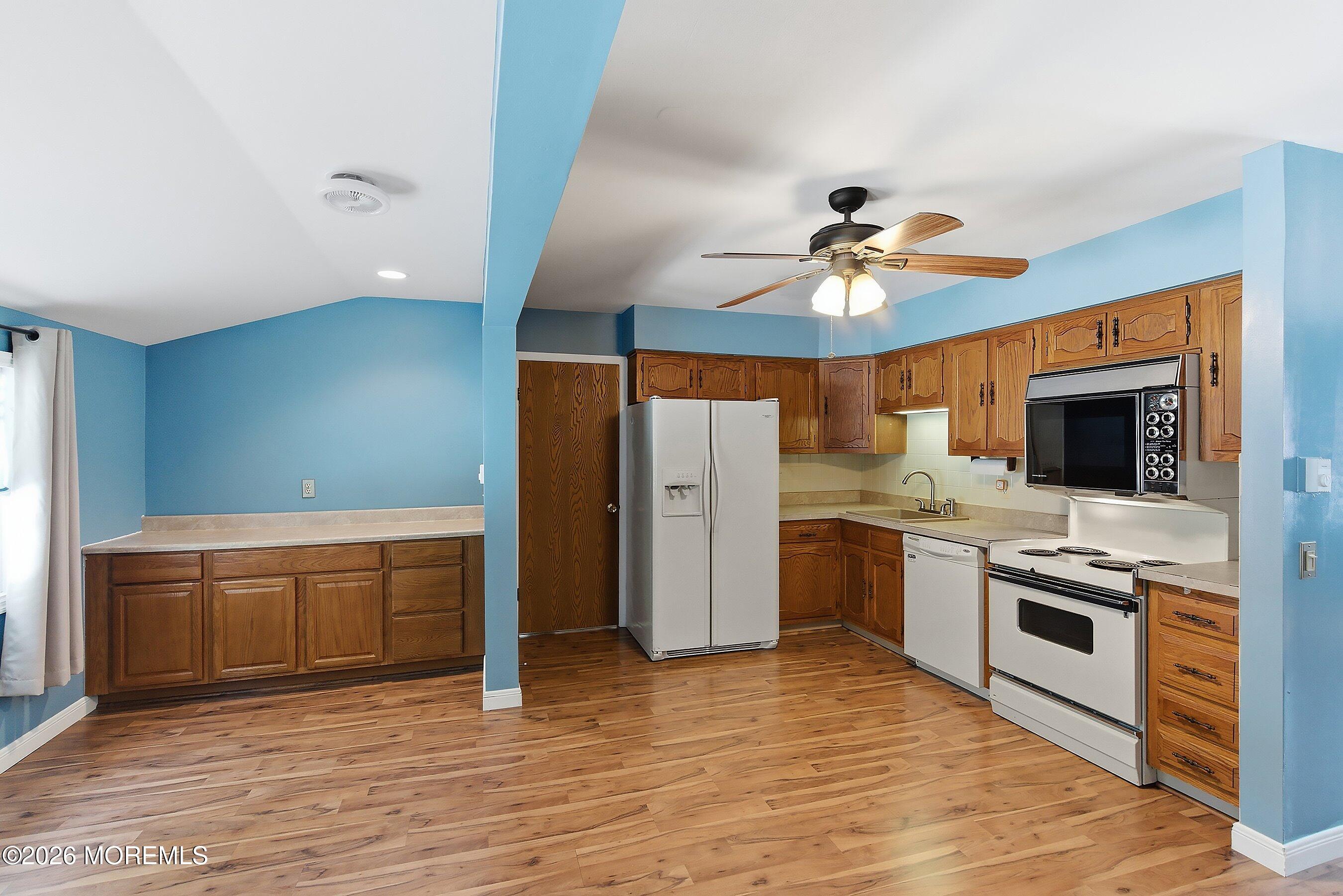 14 Medford Road, Unit 61 Whiting, NJ 08759 - Photo 6 of 36 a kitchen with stainless steel appliances granite countertop a stove and a refrigerator