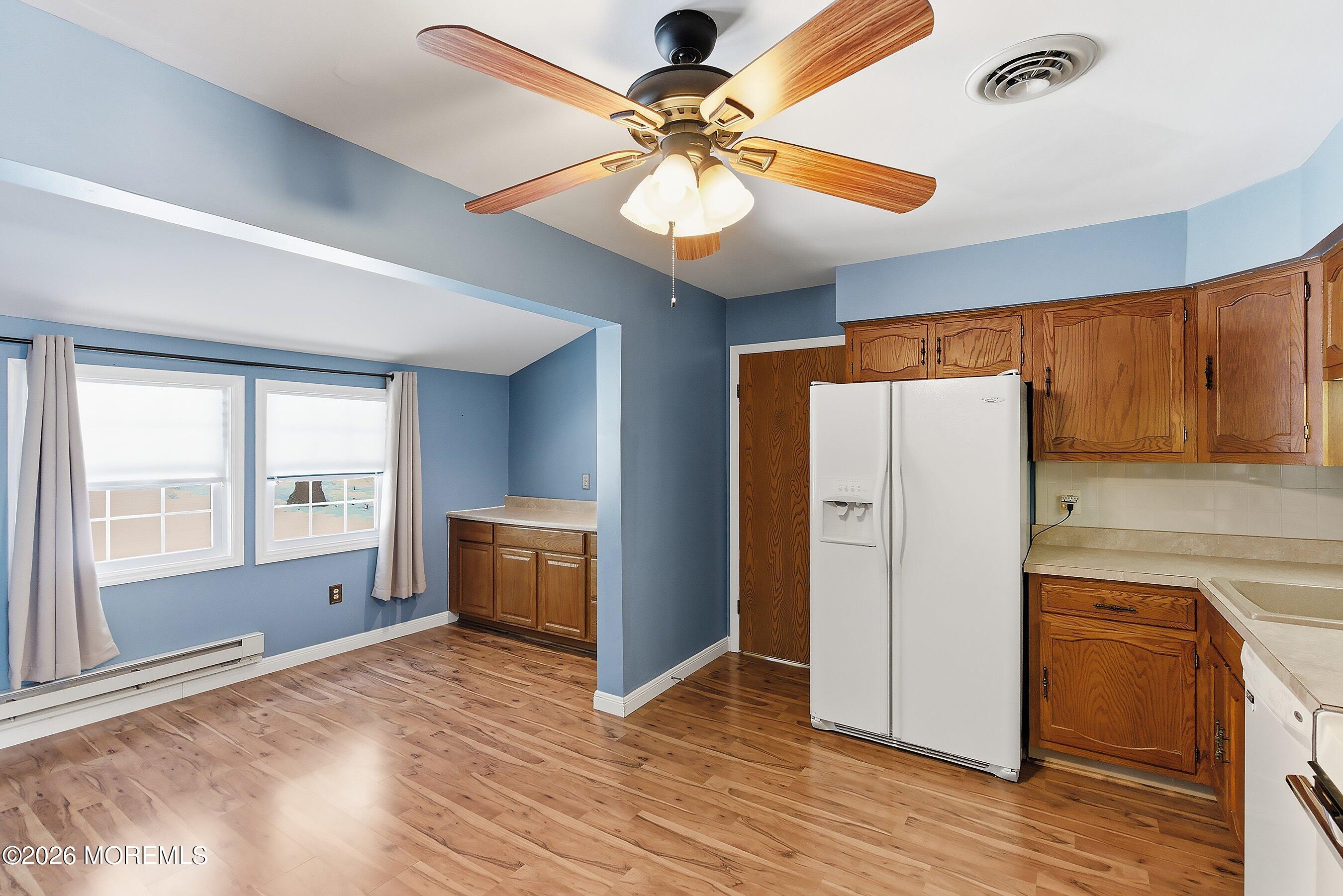 14 Medford Road, Unit 61 Whiting, NJ 08759 - Photo 8 of 36 a kitchen with a refrigerator and a stove