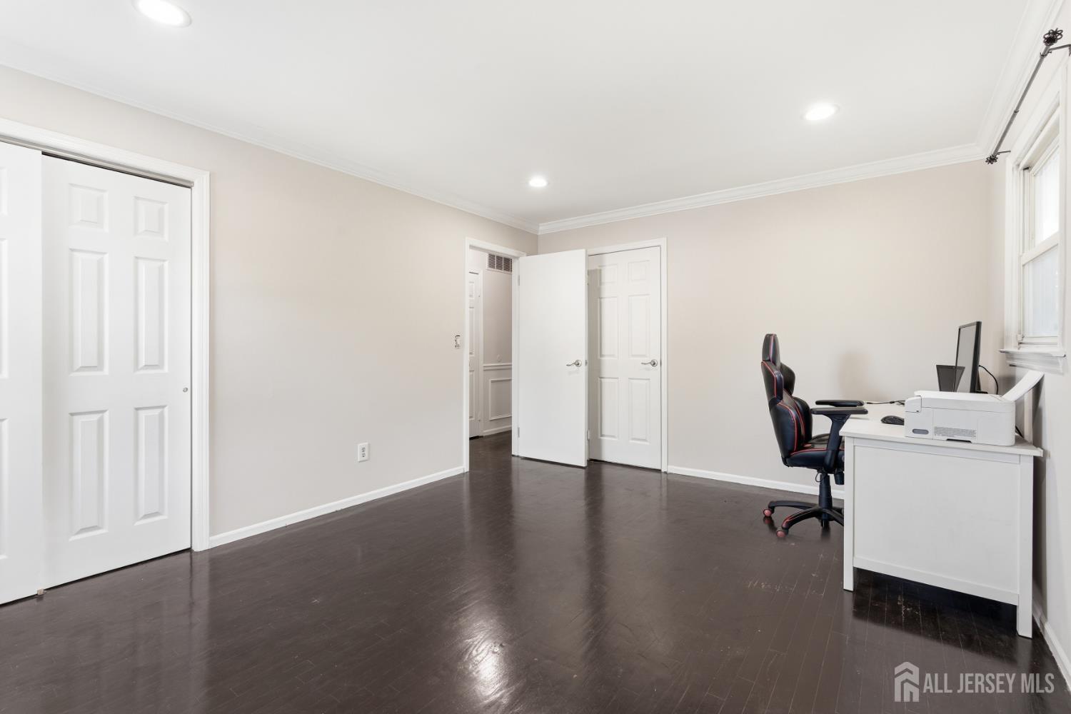 5 McKinley Street Edison, NJ 08820 - Photo 23 of 38 a view of a workspace with furniture and a window