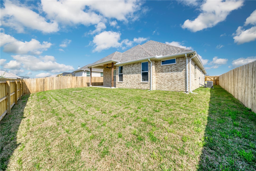 2815 Spector Drive Bryan, TX 77808 - Photo 15 of 15 a front view of a house with garden