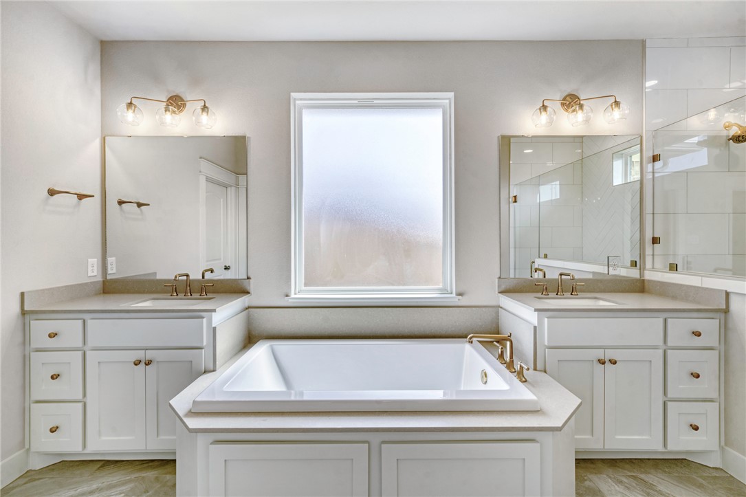 2815 Spector Drive Bryan, TX 77808 - Photo 7 of 15 a bathroom with a sink and a bathtub
