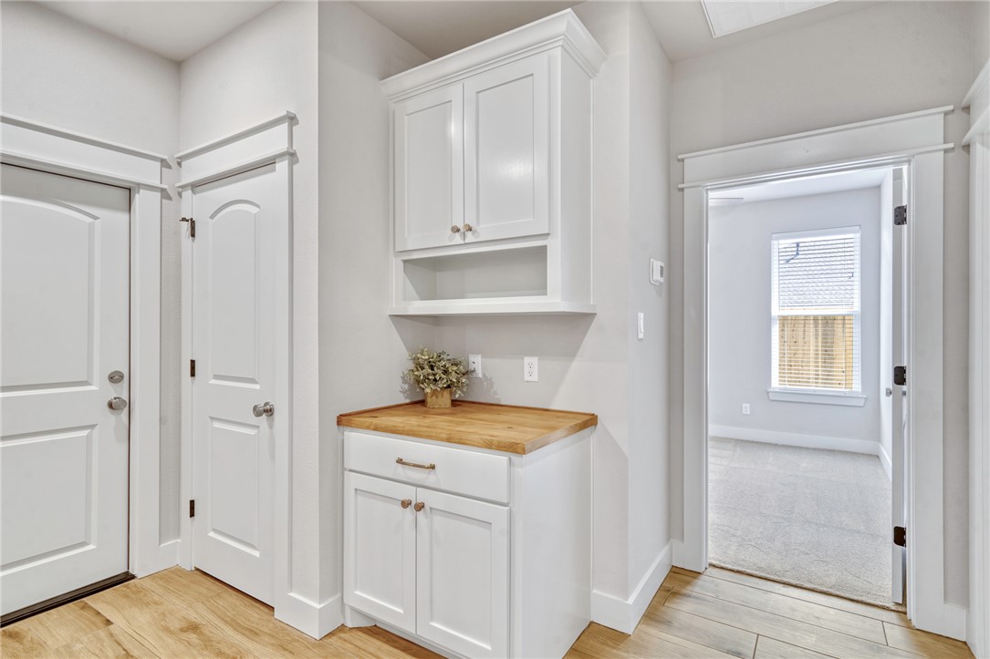 2815 Spector Drive Bryan, TX 77808 - Photo 10 of 15 a bathroom with a granite countertop sink and a mirror