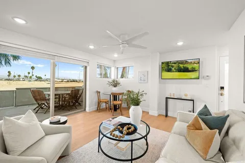 a living room with furniture a rug and a fireplace
