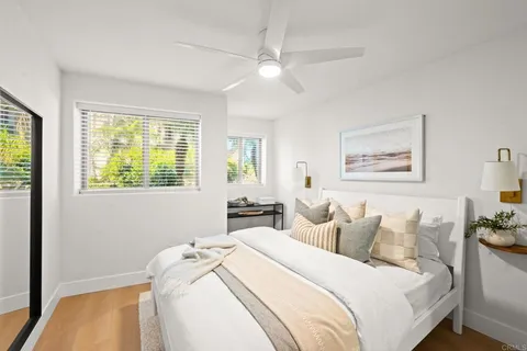 a bedroom with bed and a window